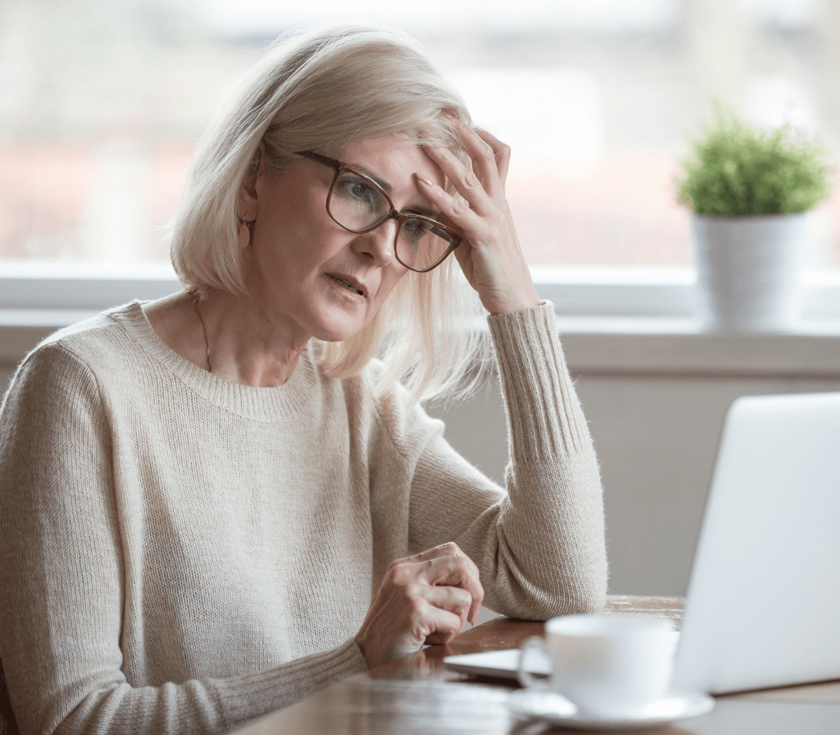 Frustrated woman looking at computer